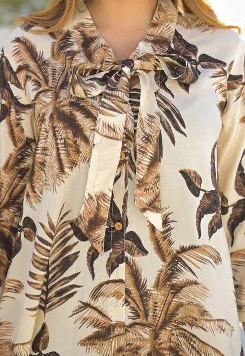 Cream-colored tropical leaf print maxi dress